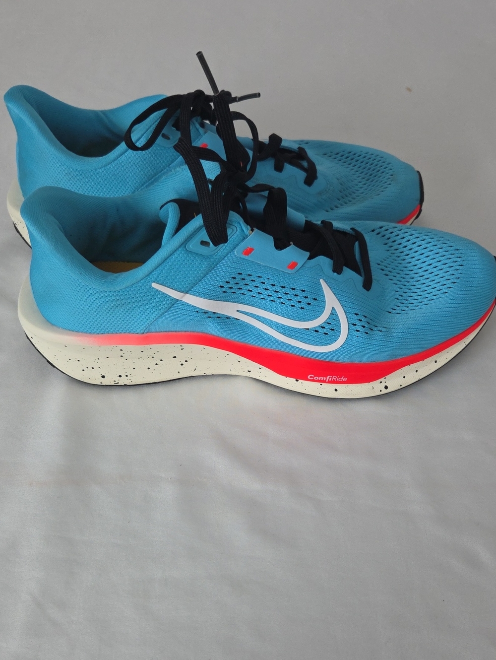 Nike Turquoise Running Shoes with Coral Trim and White Swoosh